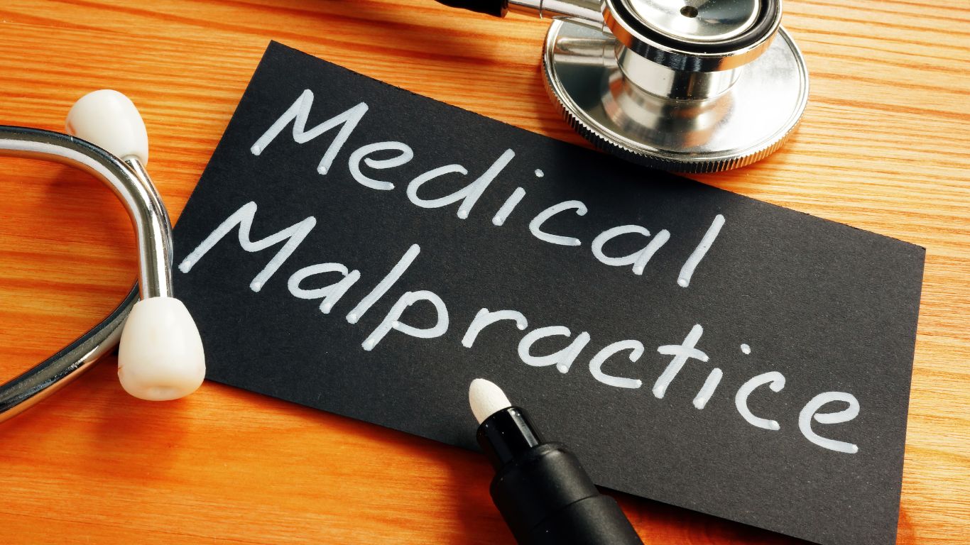 medical malpractice written on black paper